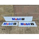 Three plastic Mobil advertising signs.