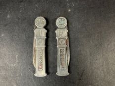 Two different version Esso branded penknives in the shape of petrol pumps.