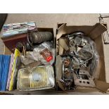 Two boxes of assorted spares including a partial Vauxhall 30/98 switch panel, Lucas bulb holders,