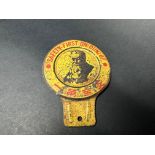 An unusual Dunlop tin 'safety first' badge with Oriental characters below an image of 'Mr Dunlop'.