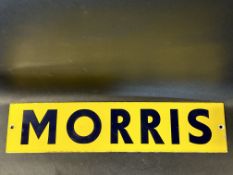 A small enamel sign bearing the name Morris, bright gloss, 22 x 5".