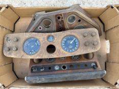 A box of dashboard panels including Armstrong Siddeley and Jaguar.