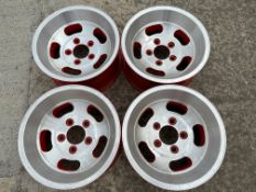 A set of four alloy wheels, 15 1/4" diameter, appear new or refurbished.