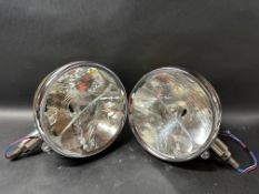 A pair of Marchal torpedo-shaped headlamps.