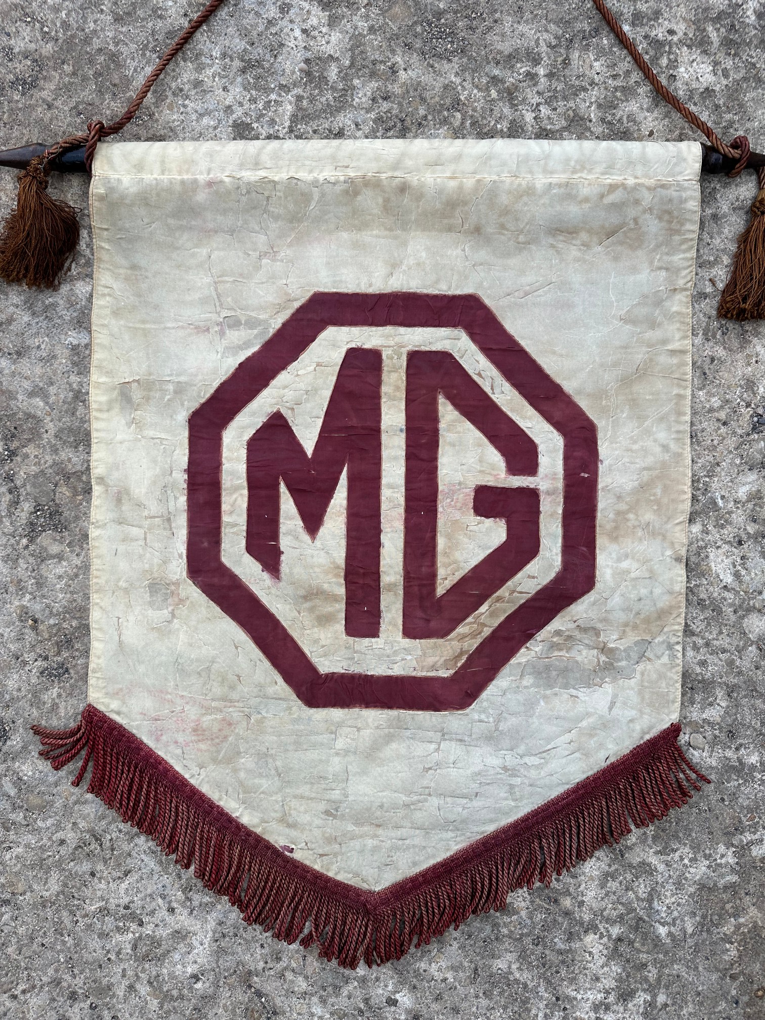 An original MG showroom banner, circa 1940s/1950s.