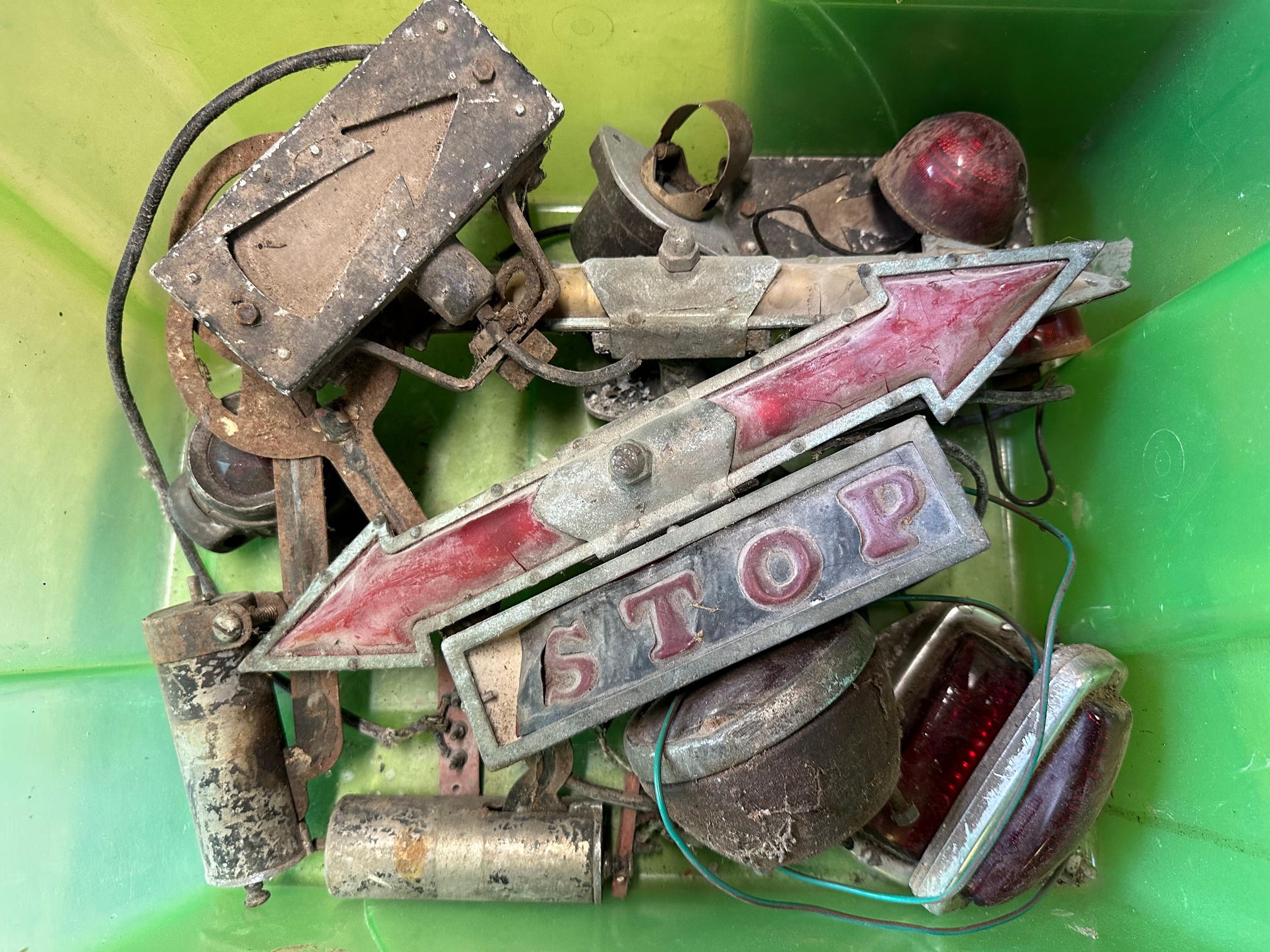 A box of various parts including rear lights, windscreen mounted 'illuminated arrow' indicators