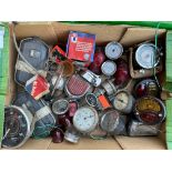 A good box of car parts including speedometers, lights, switches etc.