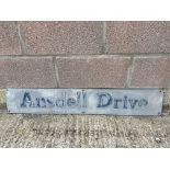 A metal road sign for Ansdell Drive, 42 x 7".