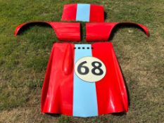 A set of fibreglass body panels to suit a Triumph TR4 race car.