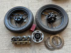 A quantity of Yamaha FZ750 spares comprising wheels, discs, rear sprocket, carburettors, fairing,