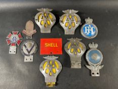 A selection of assorted car badges including Bugatti Owner's Club.