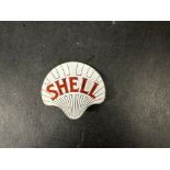 A Shell enamel lapel badge in good condition, stamped Gaunt.