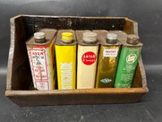 Five European oil cans in wooden shelf.
