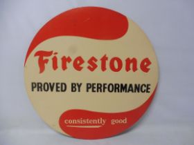 A Firestone Tyres circular cardboard tyre insert sign: Firestone Proved by Performance, consistently