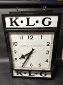 A large KLG Spark Plugs 'Fit and Forget' Smith electric hanging advertising clock, 23 1/2" wide, 35"