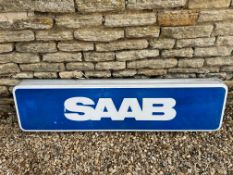 A long rectangular Saab dealership lightbox advertising sign, double sided, 61 1/2 x 16 3/4, 4 3/