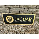 A Jaguar Authorized Dealer singled sided tin advertising sign, 36 x 14".