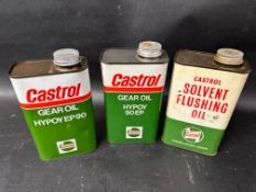 A Castrol Solvent Flushing Oil quart can and two Castrol Hypoy Gear Oil quart cans.
