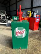 A garage forecourt bulk oil dispensing pump with Castrol sticker to front.