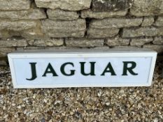A contemporary Jaguar light-up sign with green lettering on white panel, 39 1/4 x 10 1/4", depth