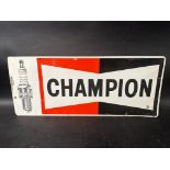 A Champion spark plug pictorial tin advertising sign, made by Milldon Signs Limited. 23 x 9 1/2".