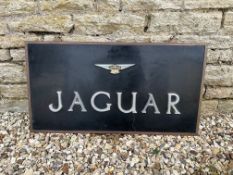 A Jaguar double sided showroom sign with alloy letters on black background with brass surround, 34 x