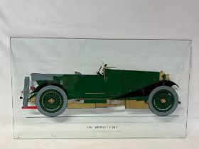 A reverse painted glass display panel depicting a 1926 Bentley 3 litre motor car, 36 x 20 1/2".