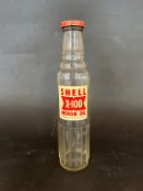 A single Shell X100 glass oil bottle, pint size.