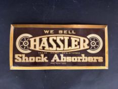 A small Hassler Shock Absorber advertising showcard, 13 1/4 x 6".
