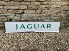 A Jaguar dealership light-up advertising sign with acrylic panel in metal box, 49 x 10 1/2, 6"
