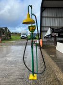 A decorative garage forecourt display piece with petrol hose and nozzle and a BP branded plaque