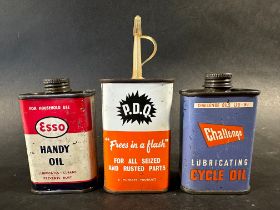 An Esso Handy Oil tin, a Challenge Lubricating Cycle Oil tin and a Filtrate P.D.Q. oil tin.