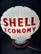 A 'Shell Economy' milk glass petrol pump globe stamped Hailware, slight nibbles to neck and fading