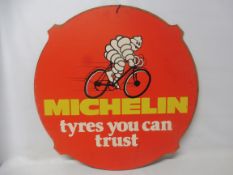 A Michelin Tyres hardboard tyre insert sign depicting Mr Bibendum riding a bicycle: Michelin - tyres