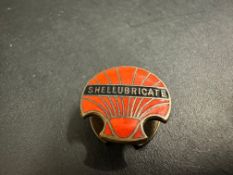 A Shellubricate enamel lapel badge by Fattorini & Sons.