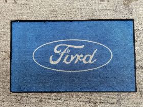 An original Ford cars (outline logo) dealer showroom mat 58 x 33 1/2".