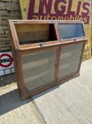 A two piece floor standing display case with one glazed panel missing, 54" wide x 46" tall