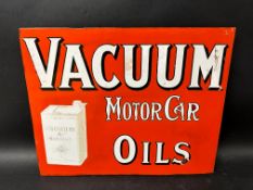 A Vacuum Motor Oils pictorial double sided enamel sign with hanging flange with some restoration,