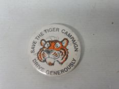 An Esso 'Save the Tiger' campaign badge.