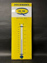 A Duckhams Q 20-50 Motor Oil enamel advertising sign with integral thermometer. 13 x 36".