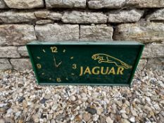 A Jaguar showroom wall clock, slight damage to one corner, 20 x 2 3/4".