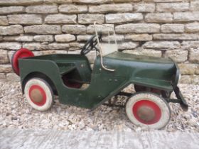 A circa late 1940s/early 1950s Triang Toys tinplate child's pedal car modelled as a Willys Jeep,