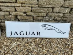 A contemporary Jaguar light up sign with black vinyl lettering on white panel, 48 3/4 x 13".
