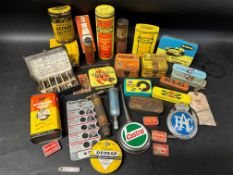 A selection of tins and advertising packaging including Dunlop, John Bull, Champion and Romac etc.