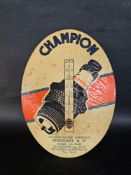 A small oval shaped Champion spark plug pictorial celluloid type advertising sign with integral