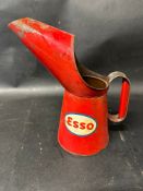 An Esso one quart pourer marked BCM/DTM to handle.