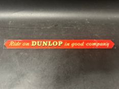 A Ride on Dunlop in Good Company printed tin advertising shelf strip, 18" across.