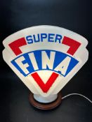 A reproduction Fina Super petrol pump globe in milk glass.