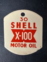 A Shell X-100 Motor Oil 30 grade enamel pump tag, approx. 2 x 2 1/2".