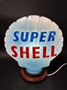 A 'Super Shell' blue glass petrol pump globe, stamped Hailware, chip to neck under original rubber